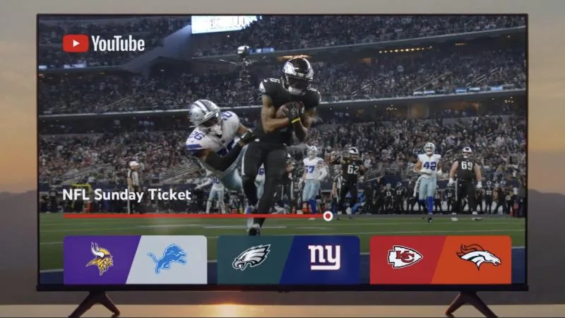 NFL Sunday Ticket playing on YouTube on a TV, with team matchup tiles below